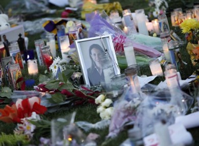 Flowers, candles and a photo of Gabrielle Giffords in Tucson, Arizona, in memory of the victims of Saturday's shooting.