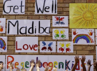 Children reach up to wish Nelson Mandela, or 'Madiba', well before his hospital discharge today.