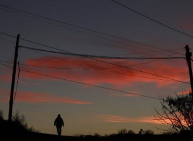 A man walks up a street in Ciudad Juarez, Mexico.