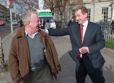Enda Kenny greets a member of the public after launching his party's election campaign last week.