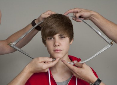 Justin Bieber is measured by Madame Tussauds' employees for a wax figure of the singer, to be unveiled in March 2011.