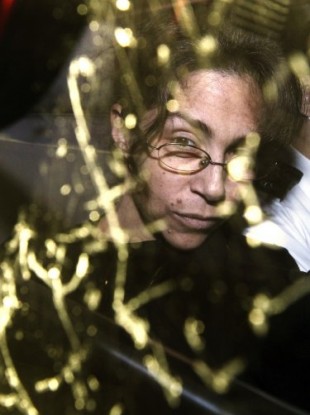 February 11, 2010 file photo, Nancy Kissel, in a prison van, arrives at the Court of Final Appeal in Hong Kong
