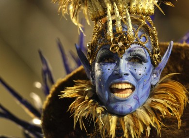 An Unidos da Tijuca samba school dancer performs during a carnival parade at the Sambadrome in Rio de Janeiro, this morning.