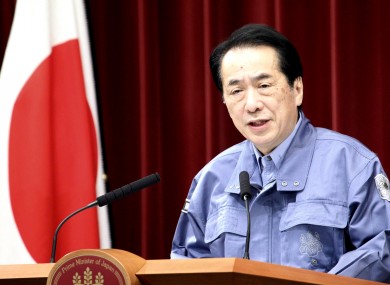 A visually shaken Naoto Kan speaks at a government press conference earlier today.