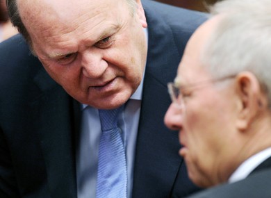 Michael Noonan speaks with German finance minister Wolfgang Schauble. Noonan will meet with his Eurozone counterparts today where more discussions on lowering Ireland's interest rate on European borrowings will again dominate the agenda.
