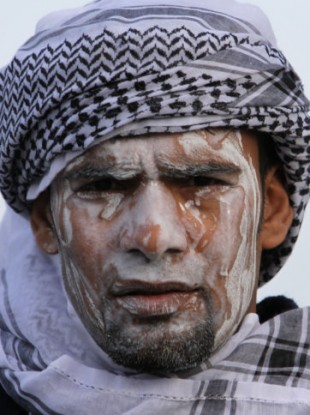 A Bahraini anti-government protester in Manama yesterday, demonstrating ahead of the arrival of Saudi troops.