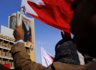 Anti-government protesters march towards the Saudi embassy in Manama, Bahrain, yesterday.