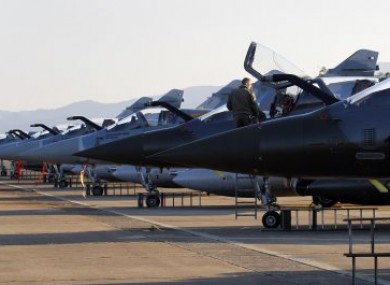 French jet fighters stand ready for a mission to Libya from Corsica yesterday.