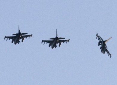 Three Dutch F-16 aircraft prepare for landing at the Decimomannu airbase, in Sardinia, Italy, Thursday, March 24, 2011