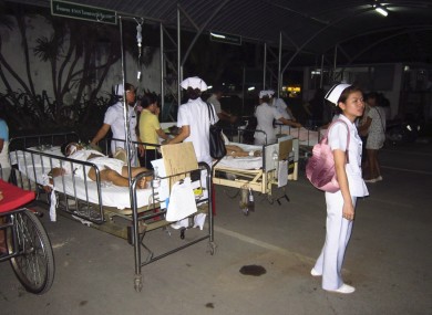 Patients at Chiang Rai hospital are treated on the ground after they were evacuated from a hospital building following an earthquake in Chiang Rai province, northern Thailand Thursday, 24 March