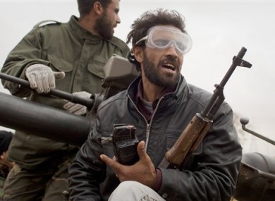 Libyan rebels arrive at the frontline on the outskirts of the city of Ajdabiya, south of Benghazi, yesterday evening.