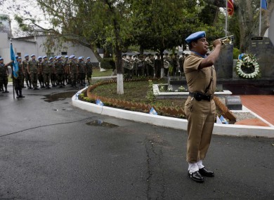A Guatemalan UN peacekeeper plays the cornet a memorial for eight Guatemalan UN peacekeepers who were killed in the DR Congo in January 2006.