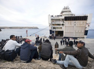 Migrants pictured waiting for a ferry in Lampedusa this morning. This boat is not the boat that sank.