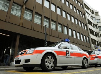 Swiss police at the scene of yesterday's bomb attack on an office in Olten.