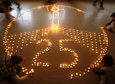 Pupils and teachers at a school in Minsk, Belarus, light candles in memory of the victims of the Chernobyl disaster in 1986.