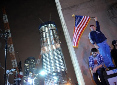 Citizens of New York City celebrate the death of Osama bin Laden, in front of the building site of the new One World Trade Centre building.