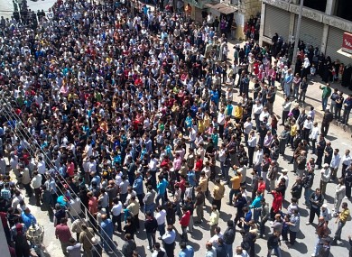 Syrian anti-government protesters gather in the coastal town of Banias on Friday.