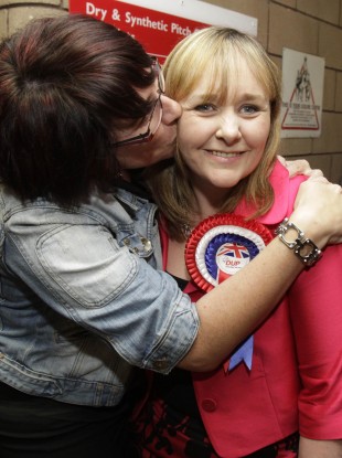 Michelle McIlveen of the DUP who topped the poll in the Strangford constituency is kissed by a supporter.