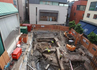 Archaeologists digging at the site in Meeting House Square