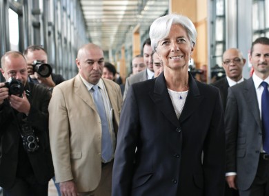 French Finance Minister Christine Lagarde arrives to announce her candidacy surrounded by members of her staff