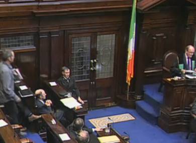 Richard Boyd-Barrett (left) leaves the Dáil chamber after being ordered to do so by Ceann Comhairle Seán Barrett.