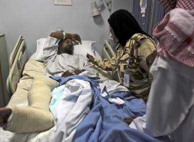 A Bahraini military medical worker treats a patient in Riffa, Bahrain. 47 medical professionals have been charged with participating in the anti-government demonstrations.