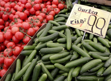 Tomatoes and cucumbers from Holland are displayed for sale at a market in Berlin. An EU lab has said there is no reason to suspect vegetables as being the source of the new E.coli outbreak.