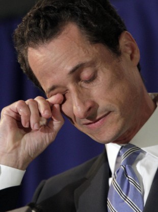 Dry your eyes mate: Congressman Weiner sheds a tear during his press conference yesterday.