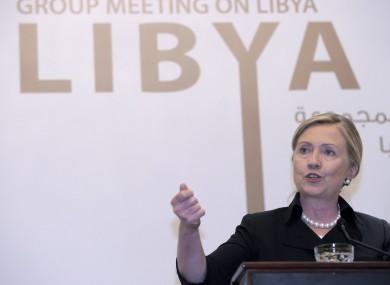 Hillary Clinton gestures during a news conference at the Emirates Palace Hotel in Abu Dhabi during a 22-nation group meeting on Libya.