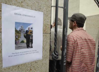 People queue to sign books of condolence at Brian Lenihan's constituency office in Castleknock Dublin. Lenihan died yesterday, aged 52