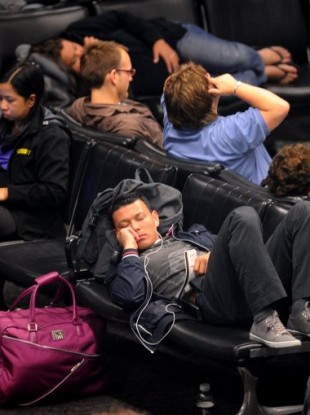 United Airlines passengers waiting at San Francisco International Airport this morning.