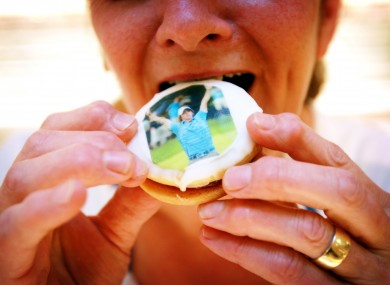 Valerie Skinner with one of the buns baked by her son Colin, in Skinners Bakery in Holywood, Co Down today.