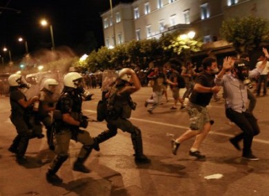 Greek riot police tackling protesters in Athens early this morning.