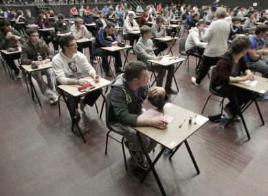 Students at Belvedere College in Dublin sit the second day of their Leaving Cert exams yesterday.