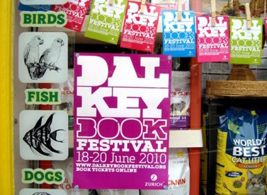 A poster for last year's festival hangs in a shop window