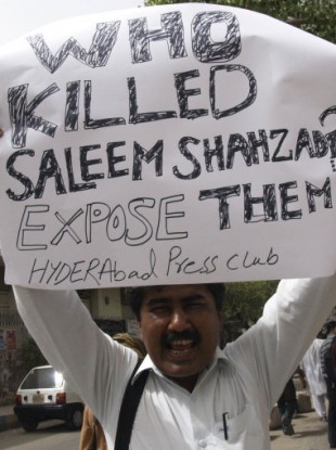 June 2011: A Pakistani journalist joins protests against Shahzad's killing.