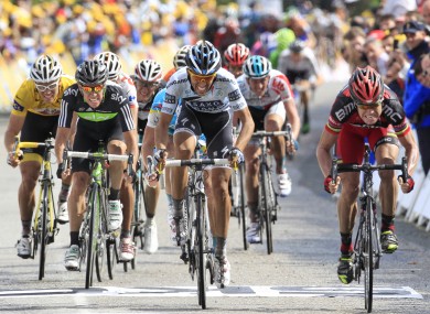 Stage winner Cadel Evans of Australia, right. leads the sprint ahead of three-time Tour de France winner Alberto Contador of Spain, center, and Thor Hushovd of Norway, far left.