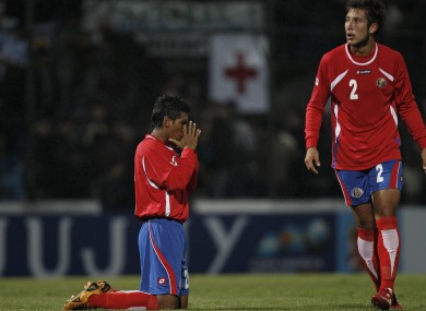Costa Rica's Pedro Leal, left, prays at the end of last night's win.