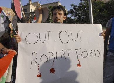 Pro-government protesters want the US ambassador, Robert Ford, out of their country.