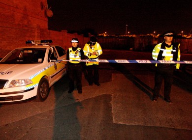 Police behind a cordon close to the scene of the explosion last night.