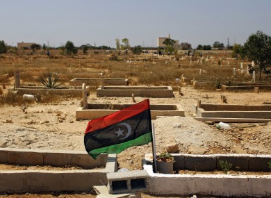 The flag of the Libyan opposition at the grave of a rebel killed in recent fighting.