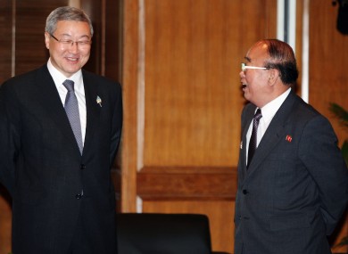 North Korea's foreign minister Pak Ui Chun, right, speaks with his South Korean counterpart Kim Sung-hwan at an ASEAN conference on Saturday.
