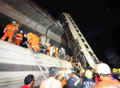Rescuer workers at the scene of the Wenzhou rail crash.