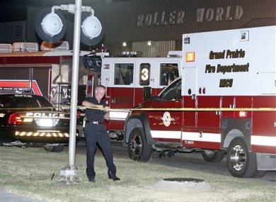 Police seal off the scene of last night's shooting at the Roller World rink in Grand Prairie, Texas.