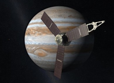 An artist's depiction of the NASA Juno spacecraft in front of Jupiter.
