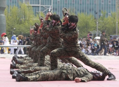 File photos of South Korean soldiers during a martial arts demonstration in May 2011.