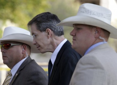 Warren Jeffs, centre, is escorted by Texan officers into court on Friday, 29 July, 2011.