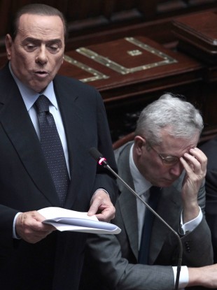 Silvio Berlusconi addresses parliament on the state of the economy. His finance minister Giulio Tremonti sits beside him.