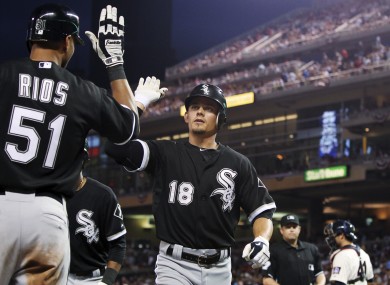 Brent Lillibridge is congratulated by Alex Rios -- probably because he has a really cool alter-ego.
