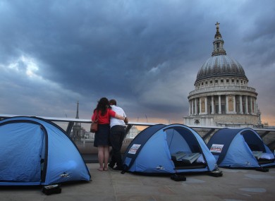 Campers prepare to spend the night on top of a London skyscraper in aid of charity